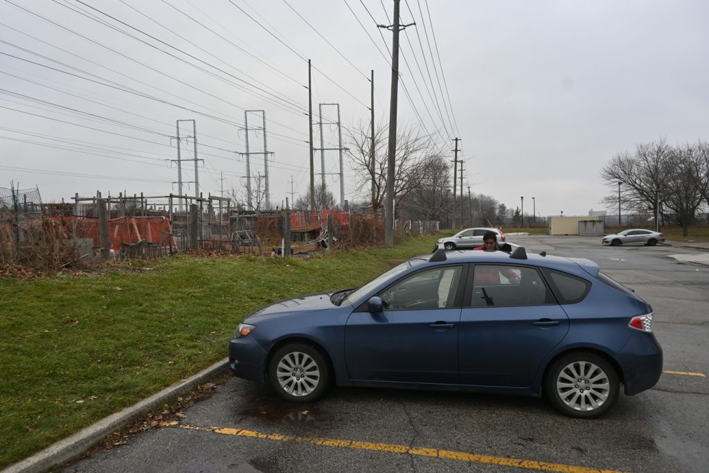 Blue Subaru parked by Hydro Right-of-Way